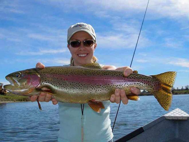 girl with large sacramento river trout